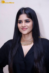 Actress Megha Akash in a black dress