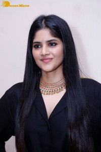 Actress Megha Akash in a black dress