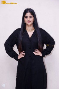 Actress Megha Akash in a black dress