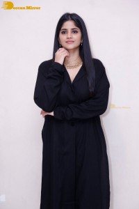Actress Megha Akash in a black dress