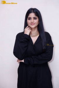 Actress Megha Akash in a black dress
