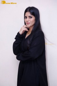 Actress Megha Akash in a black dress