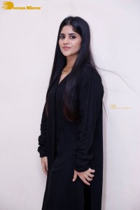Actress Megha Akash in a black dress