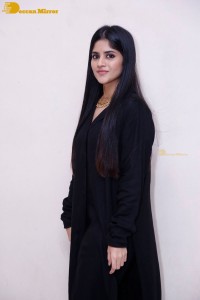 Actress Megha Akash in a black dress