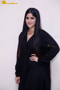 Actress Megha Akash in a black dress