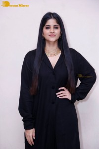 Actress Megha Akash in a black dress