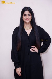 Actress Megha Akash in a black dress