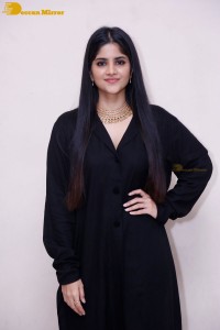 Actress Megha Akash in a black dress