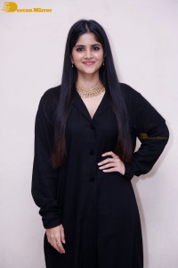Actress Megha Akash in a black dress
