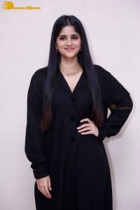 Actress Megha Akash in a black dress