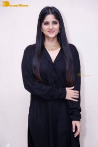 Actress Megha Akash in a black dress