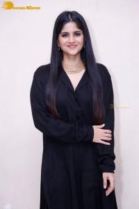 Actress Megha Akash in a black dress