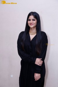 Actress Megha Akash in a black dress