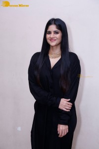 Actress Megha Akash in a black dress