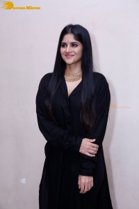 Actress Megha Akash in a black dress