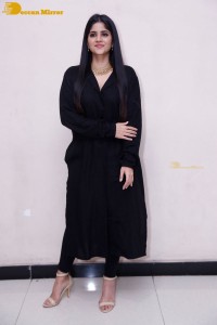 Actress Megha Akash in a black dress