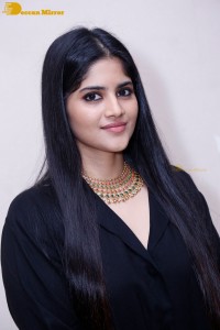 Actress Megha Akash in a black dress