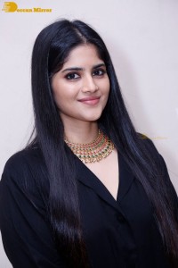 Actress Megha Akash in a black dress