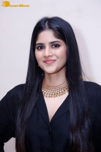 Actress Megha Akash in a black dress