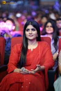 actress megha akash dressed in a red salwar suit