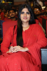 actress megha akash dressed in a red salwar suit