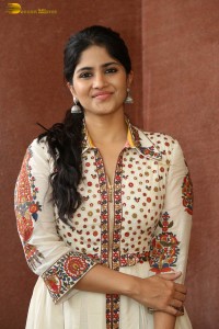 actress megha akash in a white shirt and skirt
