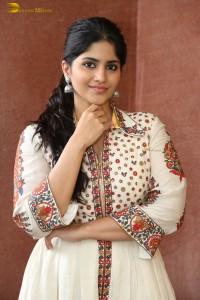 actress megha akash in a white shirt and skirt