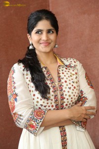 actress megha akash in a white shirt and skirt