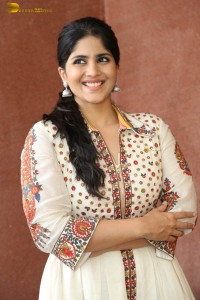 actress megha akash in a white shirt and skirt