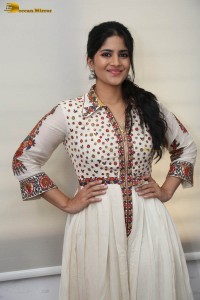 actress megha akash in a white shirt and skirt
