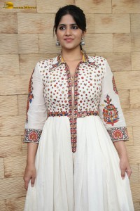 actress megha akash in a white shirt and skirt