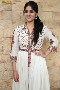 actress megha akash in a white shirt and skirt