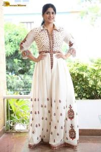 actress megha akash in a white shirt and skirt