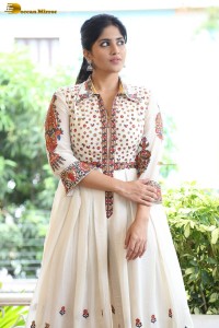 actress megha akash in a white shirt and skirt
