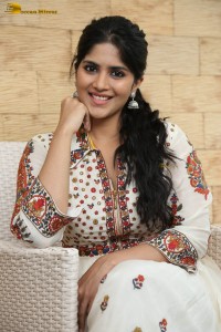 actress megha akash in a white shirt and skirt