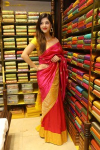 actress mehreen in a pink silk saree while inaugurating a shopping mall