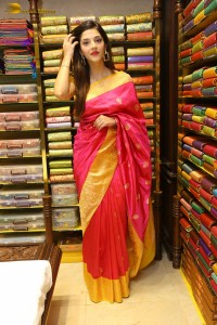 actress mehreen in a pink silk saree while inaugurating a shopping mall