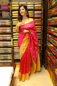 actress mehreen in a pink silk saree while inaugurating a shopping mall