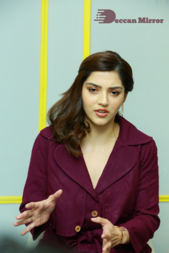 Actress Mehreen in a violet dress