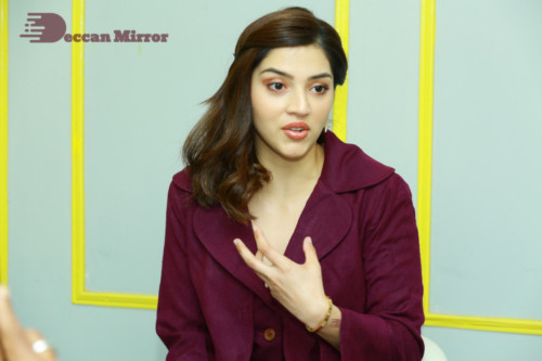 Actress Mehreen in a violet dress