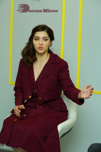 Actress Mehreen in a violet dress