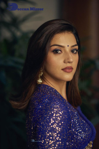 Mehreen in a dark blue saree