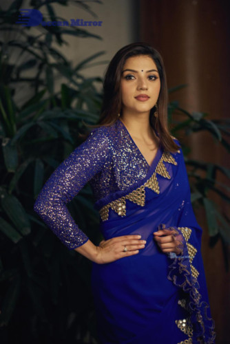 Mehreen in a dark blue saree