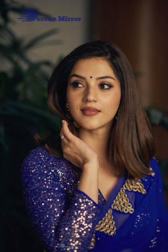 Mehreen in a dark blue saree