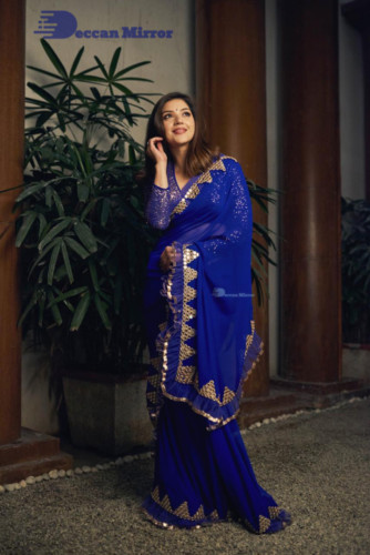 Mehreen in a dark blue saree