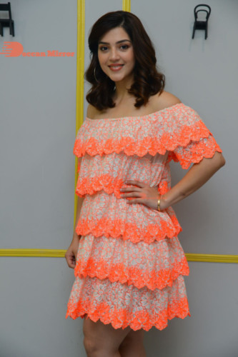 Actress Mehreen in a orange dress