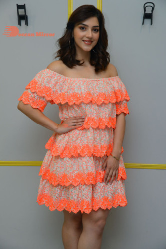 Actress Mehreen in a orange dress