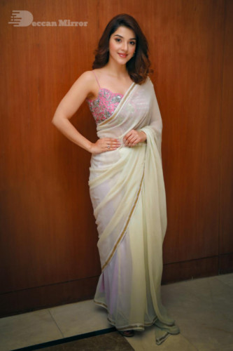 Actress Mehreen in a light yellow saree