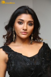 Indian Actress Mirnaa Menon in a black dress