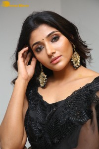 Indian Actress Mirnaa Menon in a black dress